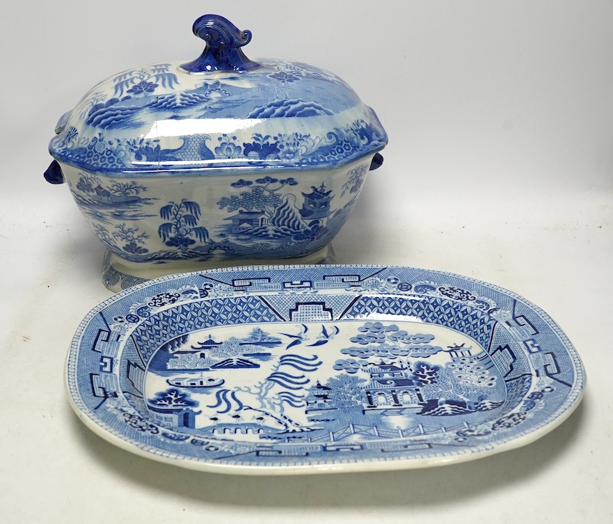 A Victorian Staffordshire blue and white pottery soup tureen and cover, together with a meat dish (2). Condition - tureen cover cracked